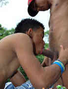 Wired-up Latinos having gay oral sex by the creek